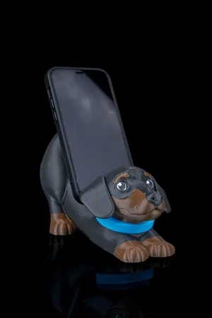 Soporte de teléfono con forma de mascota — diseño conceptual de referencia, no foto del producto final